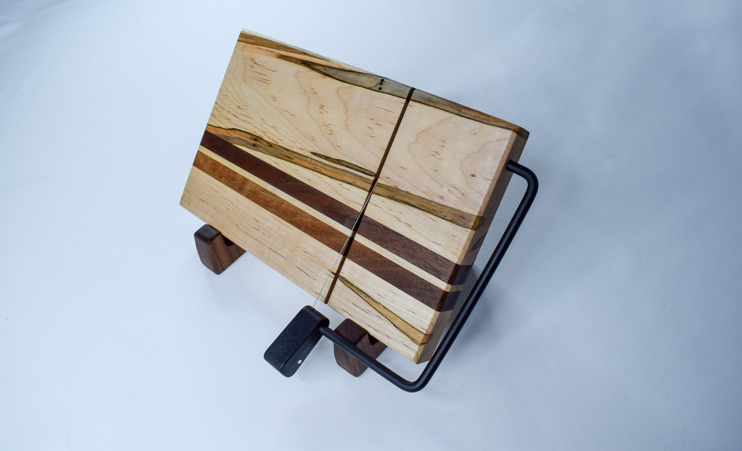 A handmade wooden cheese slicer made of ambrosia and maple wood. A perfect handmade wooden Christmas gift.