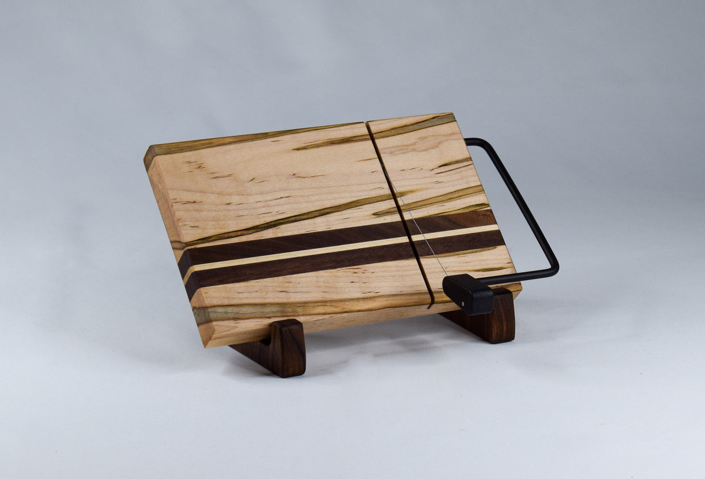 Wooden cheese slicer. Made of locally sourced ambrosia maple and walnut hardwoods and handmade in our workshop in GA.