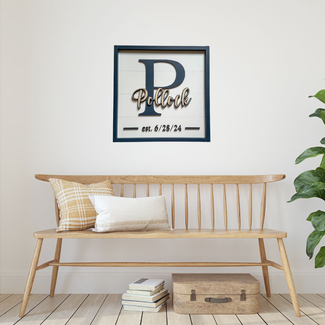 Entryway bench with custom monogram sign hanging above. Sign has white faux shiplap background with a last name overlapping a monogram and a wedding date.