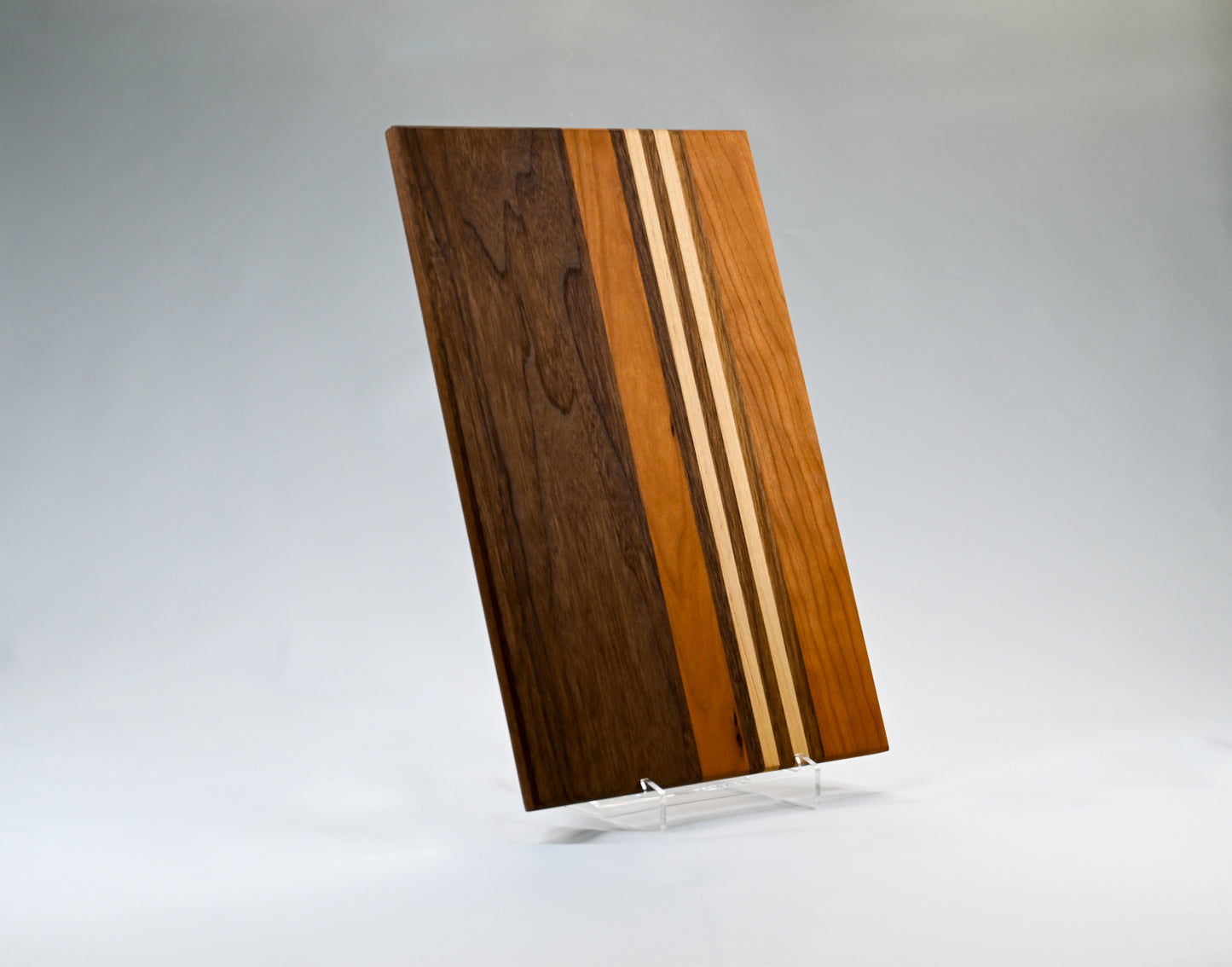 Striped cutting board handcrafted with cherry, maple, and walnut hardwoods - made in GA.