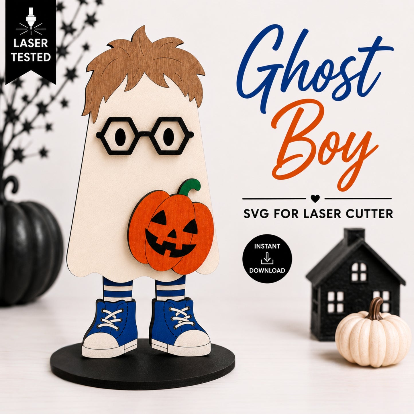 A Halloween-themed laser-cut design preview featuring a ghost boy character with brown hair, black glasses, an orange jack-o'-lantern, blue sneakers, and a cream ghost body on a black base. The image includes promotional text reading 'Ghost Boy', 'SVG FOR LASER CUTTER', 'Instant Download', and a 'Laser Tested' badge, with decorative pumpkins and a small house around the product.