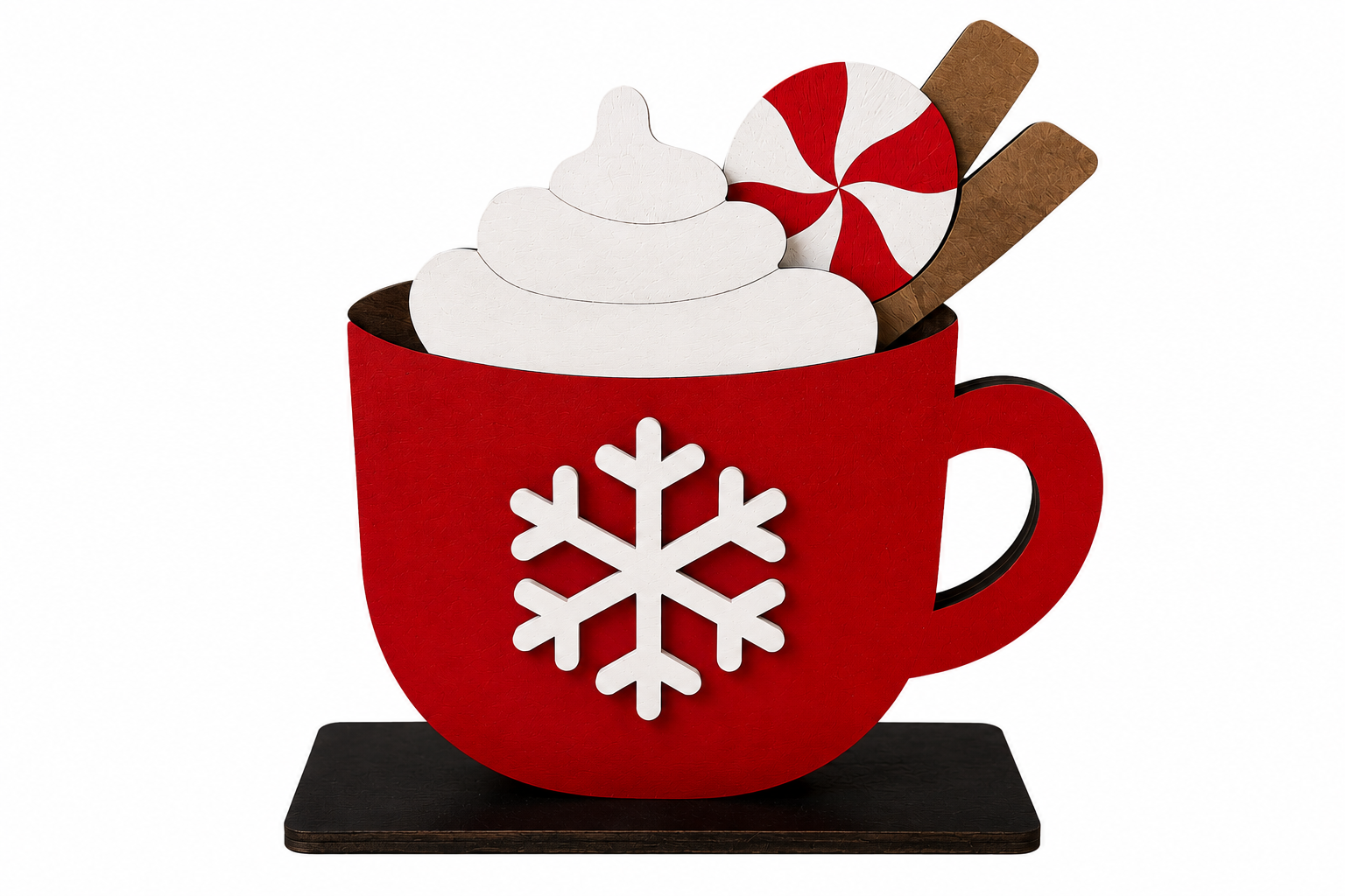 A festive hot cocoa decoration shaped like a red mug with a white snowflake, filled with white whipped cream, a red-and-white peppermint candy, and brown sticks, set on a dark rectangular base against a white background.