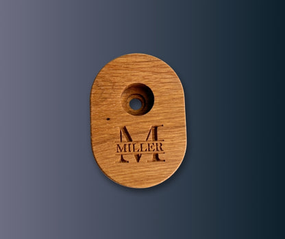 White Oak whiskey smoker with 'MILLER' engraving on a dark blue background
