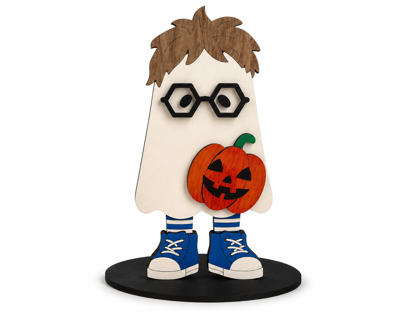 A stylized wooden ghost-shaped Halloween decoration with brown hair, black glasses, a carved orange pumpkin, blue-and-white sneakers, and a round black base, shown on a plain white background.
