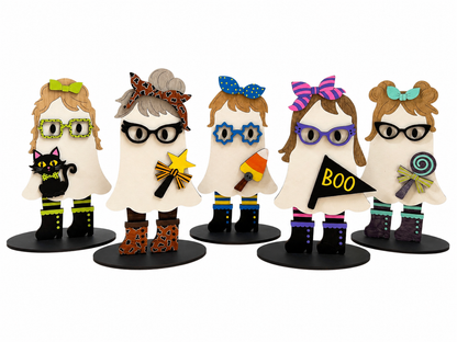 Five decorative ghost figurines with different Halloween-themed accessories, glasses, bows, and boots, displayed on black circular bases against a white background.