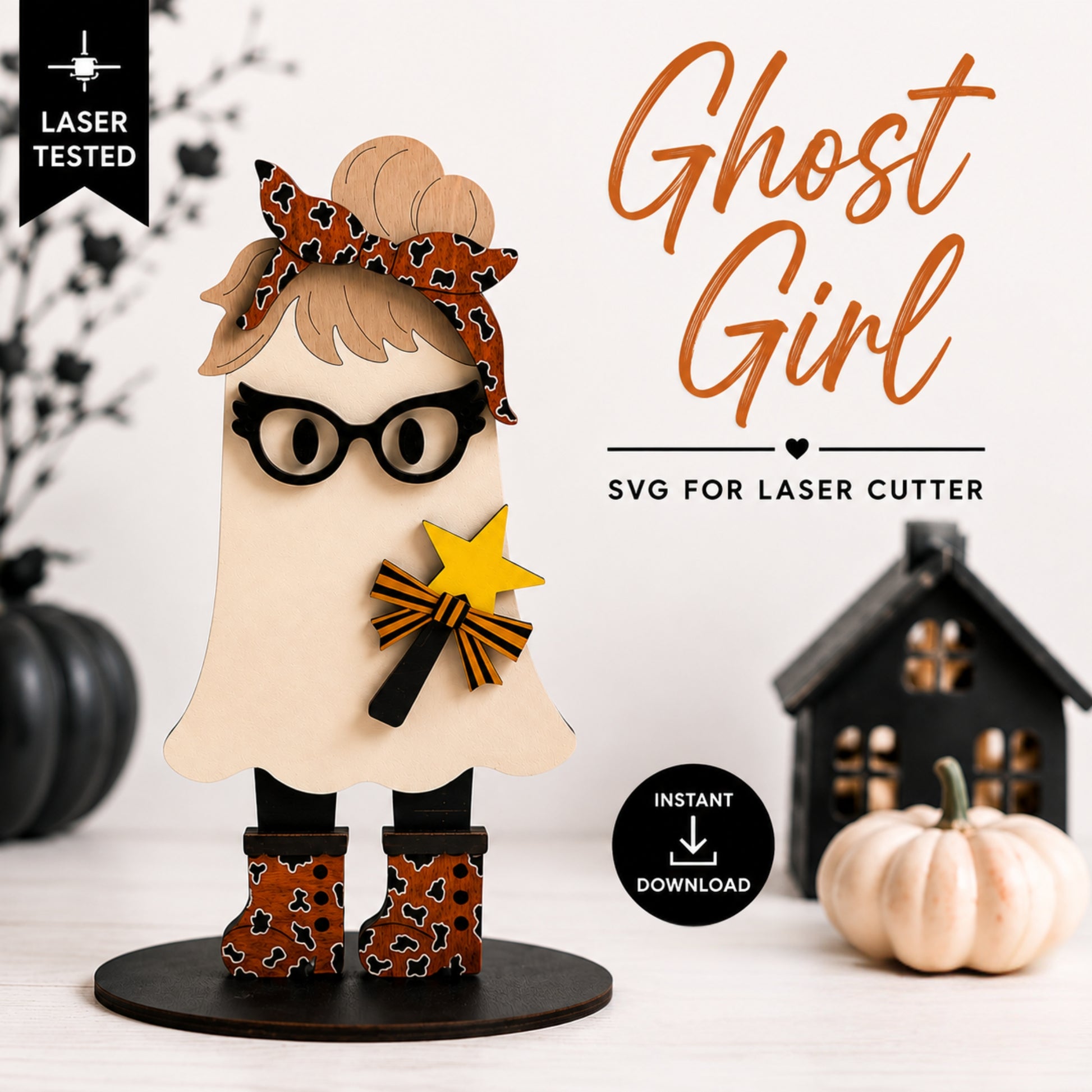 A decorative ghost-shaped figure with a leopard-print bow, black glasses, black boots, and a yellow star wand, shown on a tabletop with pumpkins and a house prop. Text reads 'Ghost Girl,' 'SVG for laser cutter,' 'Laser Tested,' and 'Instant Download.
