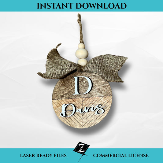 Layered wooden ornament featuring a chevron pattern with monogram “D” and the name “Davis” in white, accented with a burlap bow and wooden beads, designed for laser cutting.