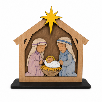 Finished wooden nativity paint kit featuring Mary, Joseph, and baby Jesus in a layered stable with a gold star and black display base.