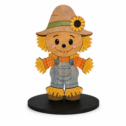 Finished layered wooden scarecrow paint kit design with sunflower hat, overalls, and black display base.