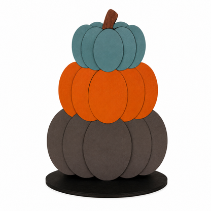 Finished wooden pumpkin stack paint kit featuring three stacked pumpkins in teal, orange, and charcoal on a black display base.