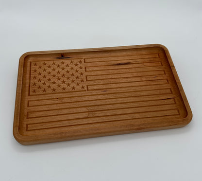 A handmade wood tray with a carving of the American Flag in Cherry wood.