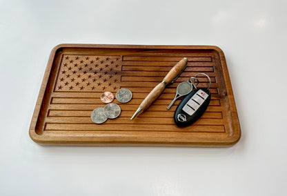 An example of how the American Flag Catch All Tray can be used by holding items such as coins, pen, and keys.