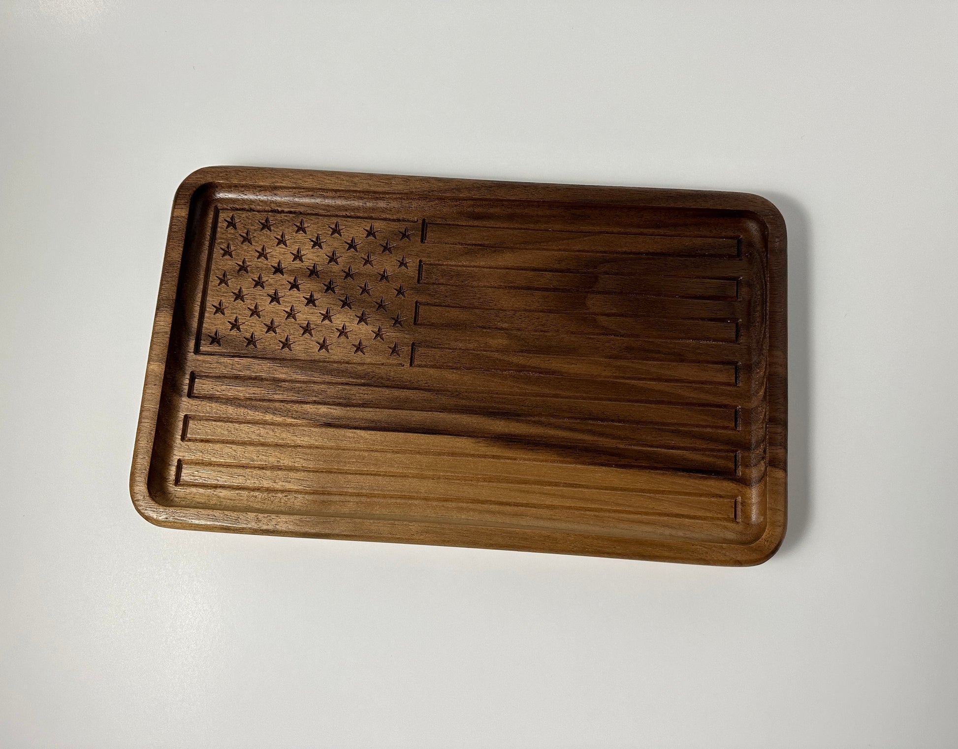 A full view of the handmade walnut wood tray craved with the American Flag.