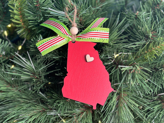 Handmade wood Christmas ornament - Red, wood Georgia ornament with a heart to show your state pride.  Adorned with a green, red, and white ribbon and wooden bead on twine for easy hanging. 