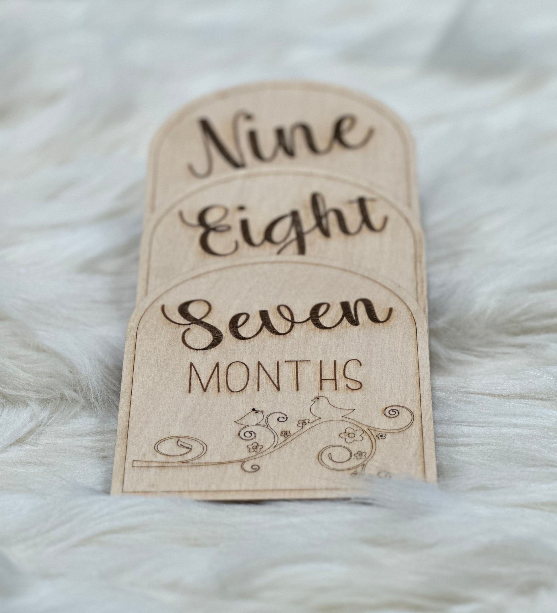 Wooden baby milestone cards.