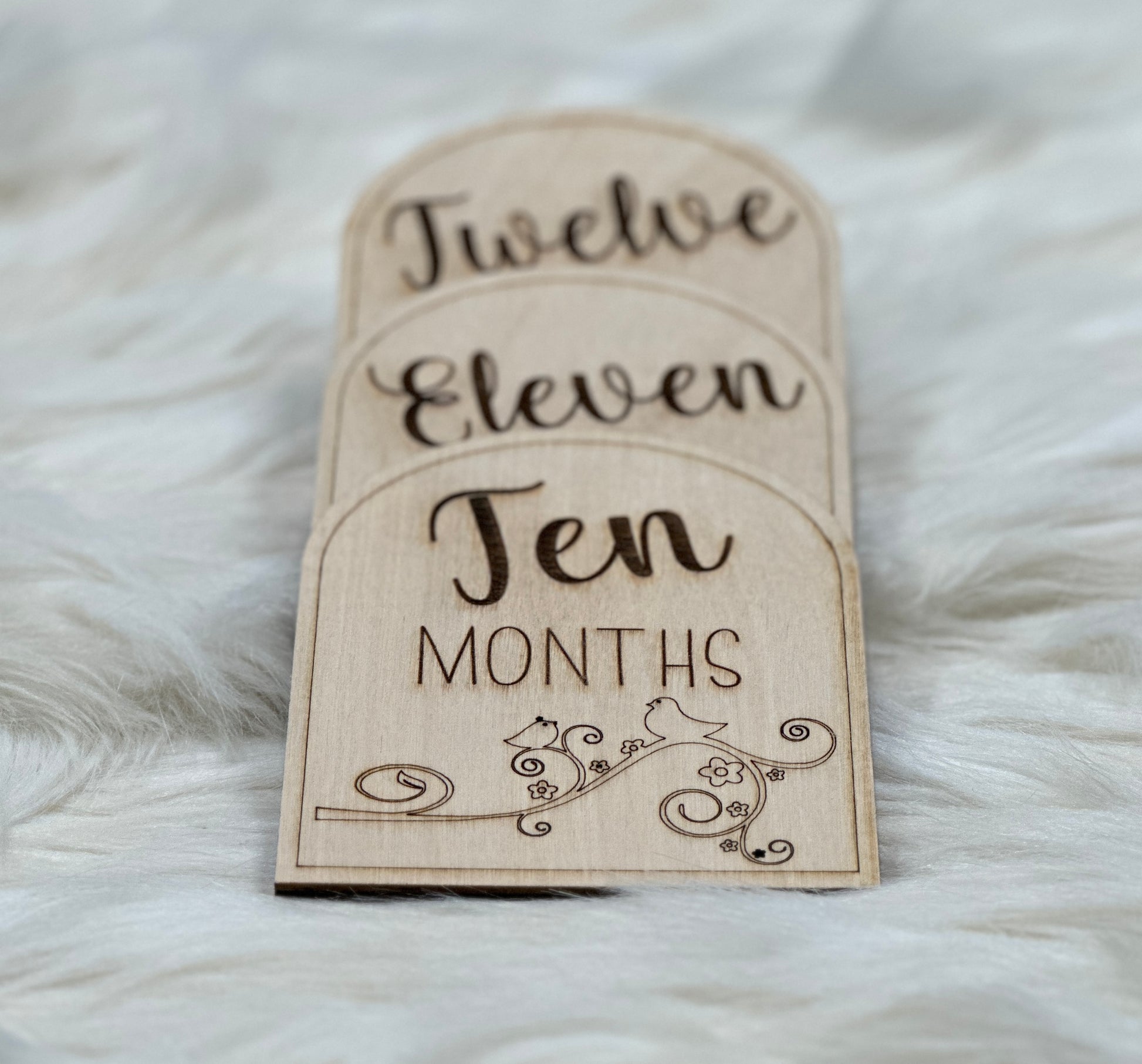 Personalized wooden baby milestone cards.