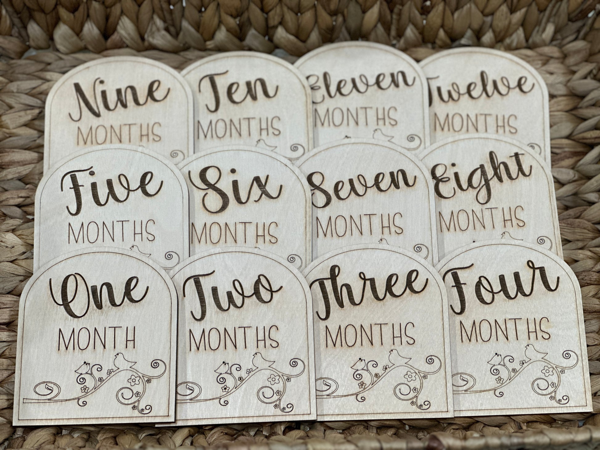 Baby milestone cards made out of wood.