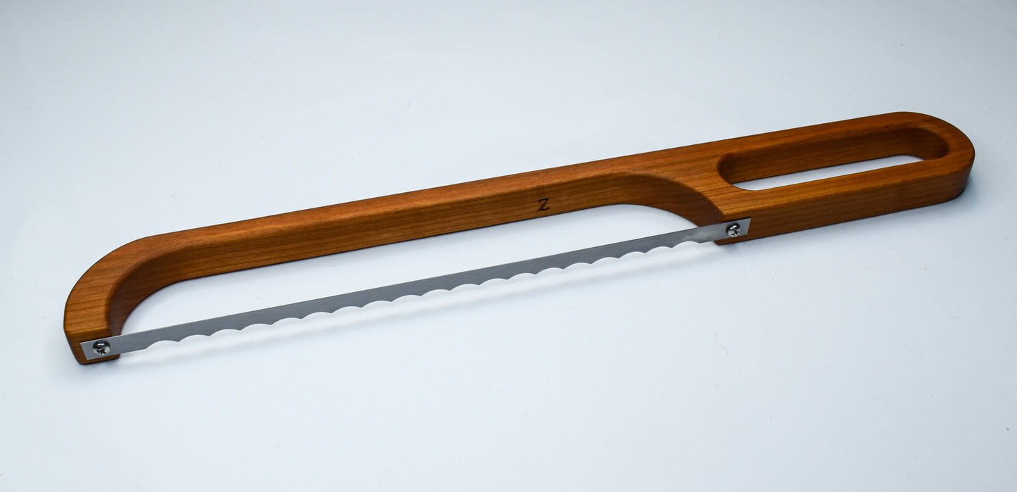 Cherry wood bread bow knife made with solid wood.