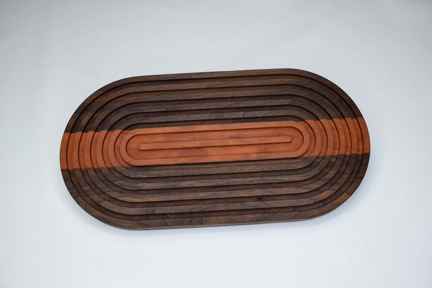 Handmade woodworking bread board made of Walnut and Cherry wood.