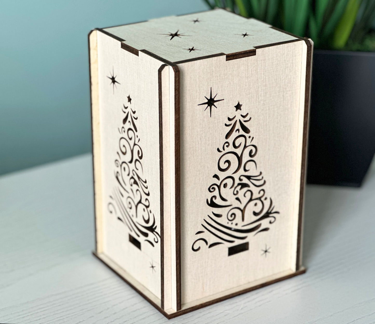 Box shaped handmade lantern with a beautiful Christmas tree design.