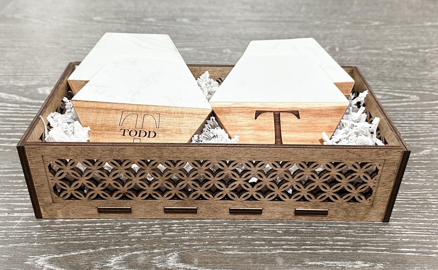 Custom woodwork gift with personalized coasters and filigree basket.