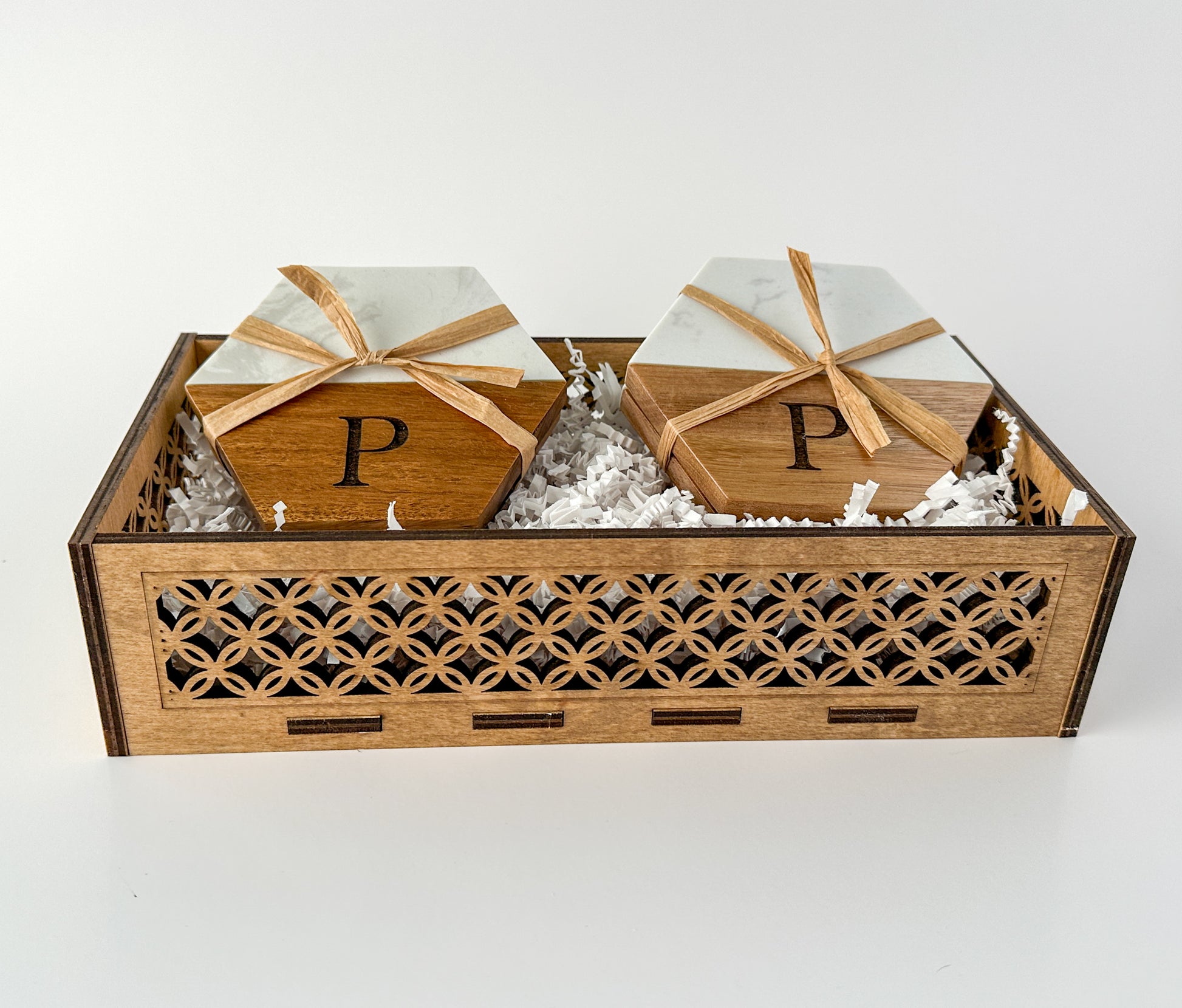 Custom wood gift for home - Personalized coasters nestled in a filigree basket.