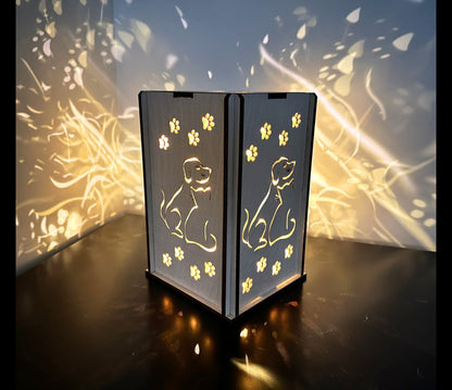 Dog and cat handmade wood lantern. Made of light colored wood and lights up a dark room.