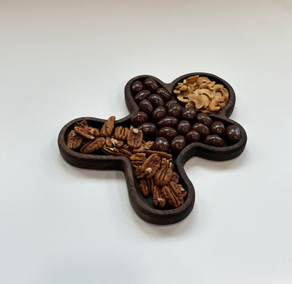 Woodwork tray shaped like a gingerbread man and made with dark Walnut wood.