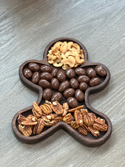 Handmade woodworking gift - a Christmas gingerbread man tray to serve nuts and chocolates.