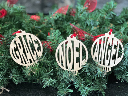 Handmade wooden Christmas ornaments with each a different word - Grace, Noel, Angel.