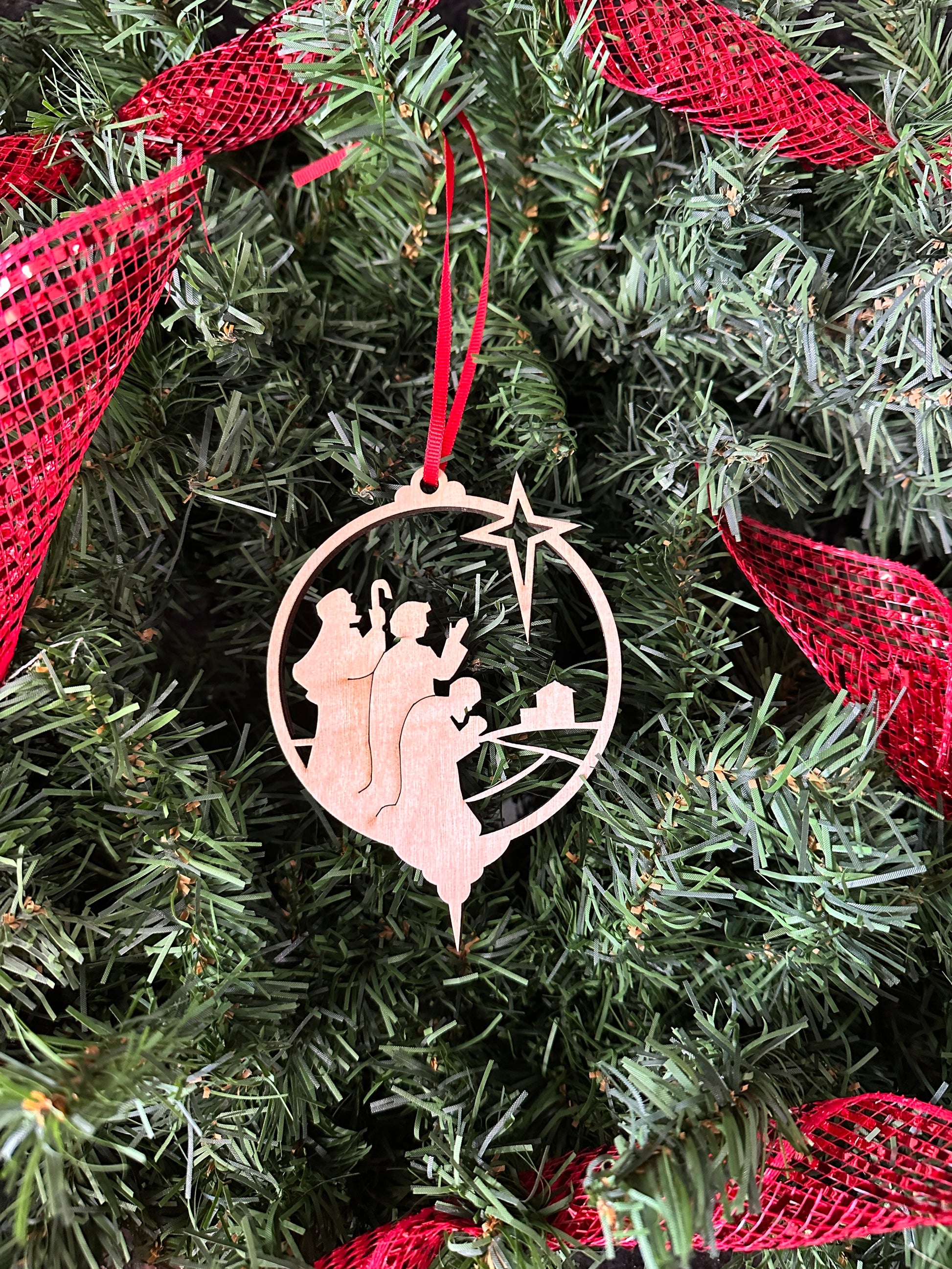 Handmade wood Christmas gift - a wooden Christmas ornament featuring a nativity scene.