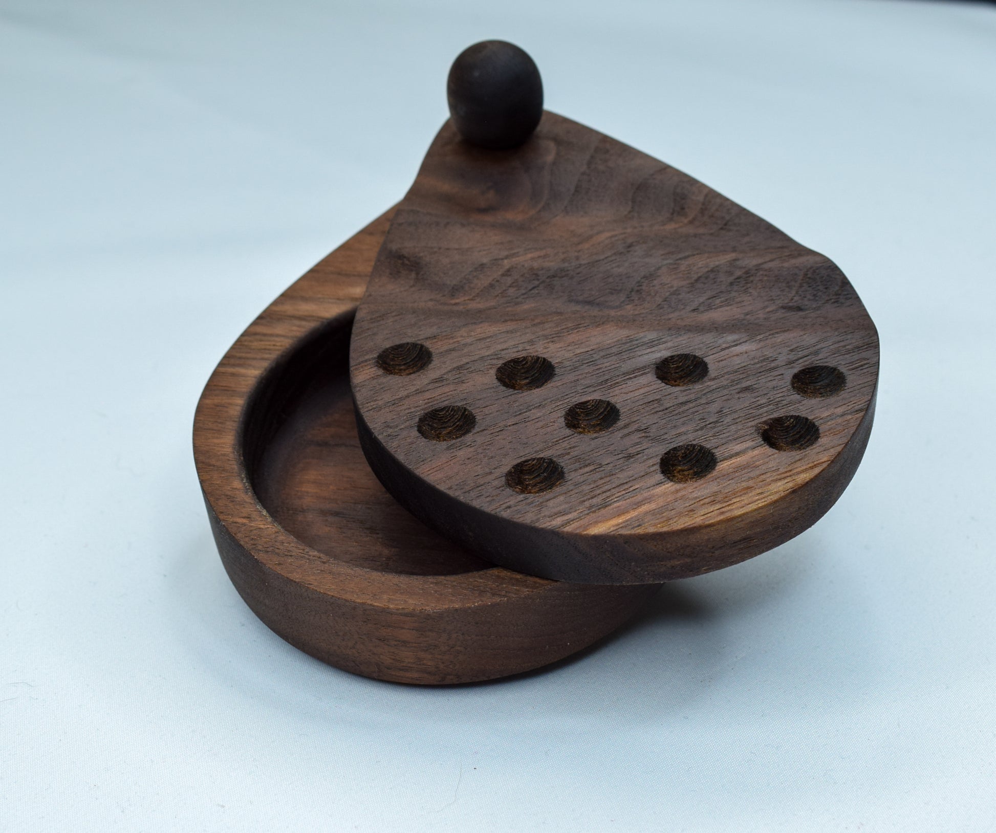 A salt cellar beautifully handcrafted with wave and dot designs on the lid.