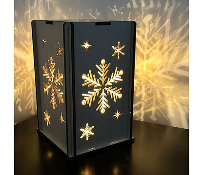 Handmade wooden Christmas gift - A snowflake lantern that cascades a beautiful snowflake picture on the wall when lit up.