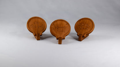 Three spoon rests handmade with cherry wood. Each with a punchy saying.