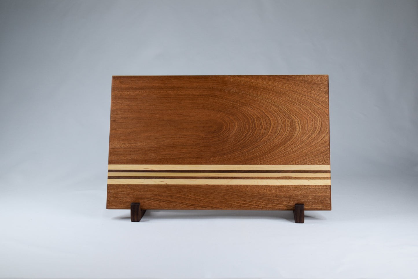 Sapele hardwood cutting board with Maple and Walnut stripes. Handmade locally in GA.