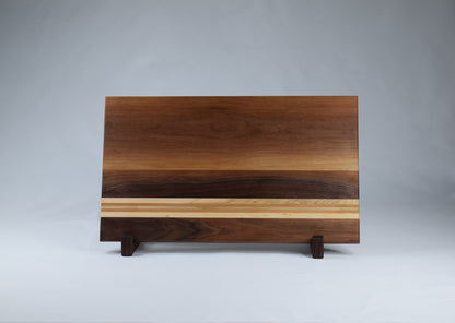 Striped cutting board featuring Walnut, Cherry, and Maple hardwoods locally sourced in Georgia.