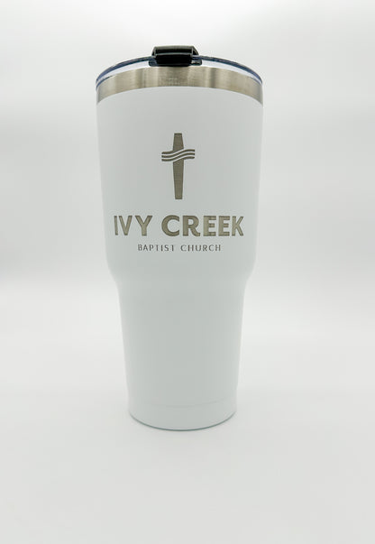 White tumbler with business name custom engraved on it. Includes BPA free lid.