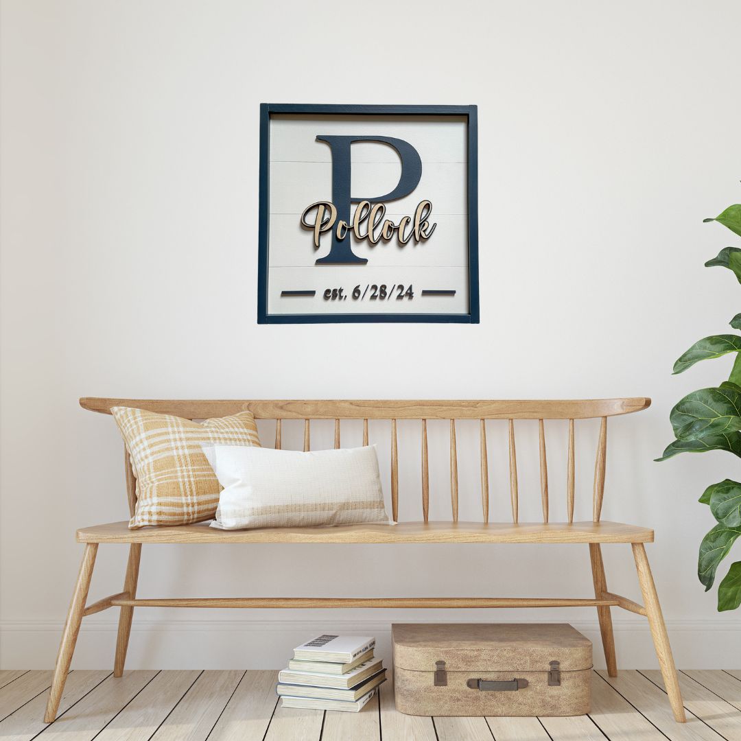 Entryway bench with custom monogram sign hanging above.  Sign has white faux shiplap background with a last name overlapping a monogram and a wedding date.