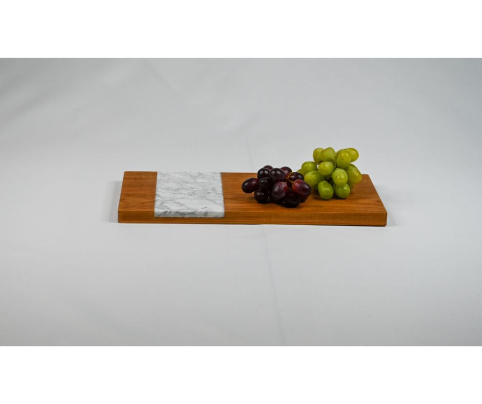 A rectangular serving board made with domestic hard wood and accented with Italian marble. Customize it with your name or monogram!